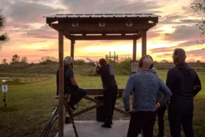 Clay shooting at sunset, outdoor gun range, OK Corral Gun Club, south Florida, central Florida